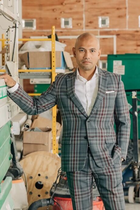 Man in plaid suit facing camera